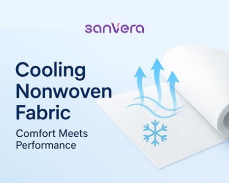 Cooling nonwoven fabric roll with breathable texture and blue airflow arrows, highlighting cool-touch performance for sanitary pads and liners