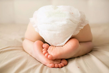 baby wearing disposable diaper from OEM hygiene product supplier